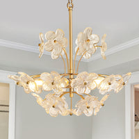 Illuminated brushed gold glass flower chandelier with layered clear ribbed glass petals