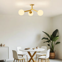 Gold frosted glass globe semi-flush ceiling light in modern dining room