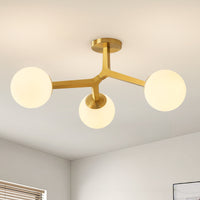Gold frosted glass globe semi-flush ceiling light installed on ceiling