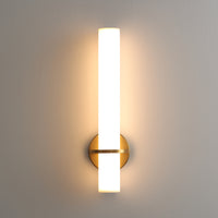 Gold LED wall sconce illuminated with warm white light