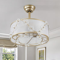 Gold-tone floral caged ceiling fan with linen shade in a bright interior