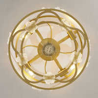 Bottom view of floral caged ceiling fan showing clear blades and decorative frame
