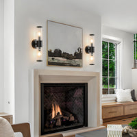 Matte black ribbed glass wall sconces beside a living room fireplace