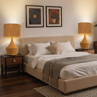 Bedroom scene with two matching boho rattan table lamps on bedside tables