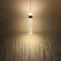 Gold bubble crystal LED pendant light illuminated with warm light