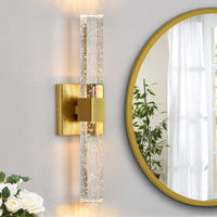 Brushed Gold Bubble Crystal Wall Sconce Beside Round Mirror